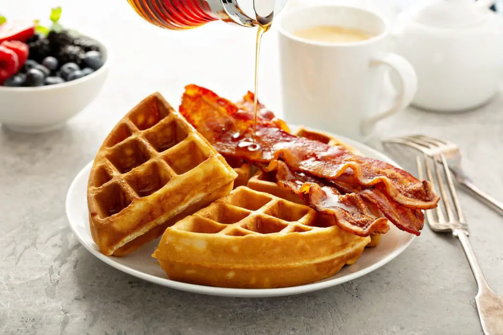 Belgian waffle with maple syrup and black pepper candied bacon